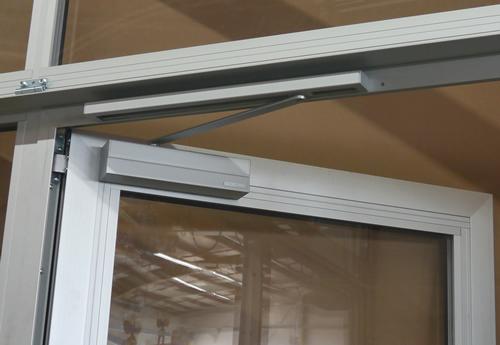 Overhead door closer with slide rail